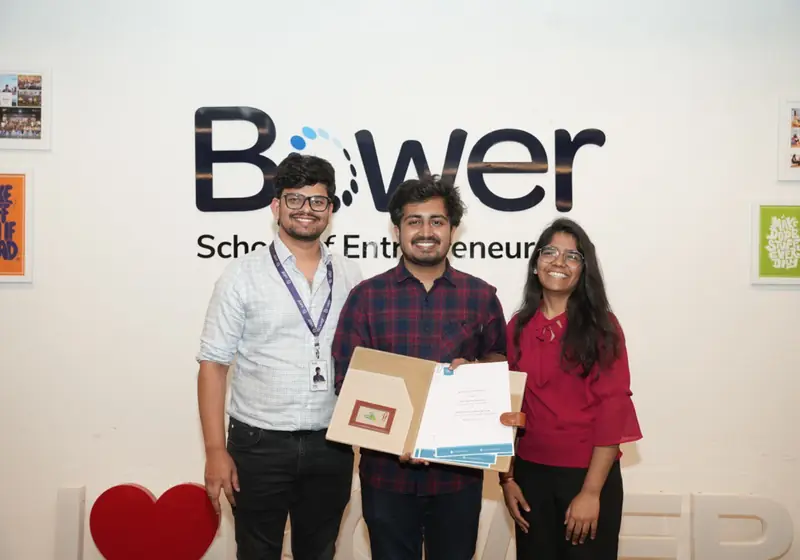Poditivity team receiving the signed MoU at Bower School of Entrepreneurship