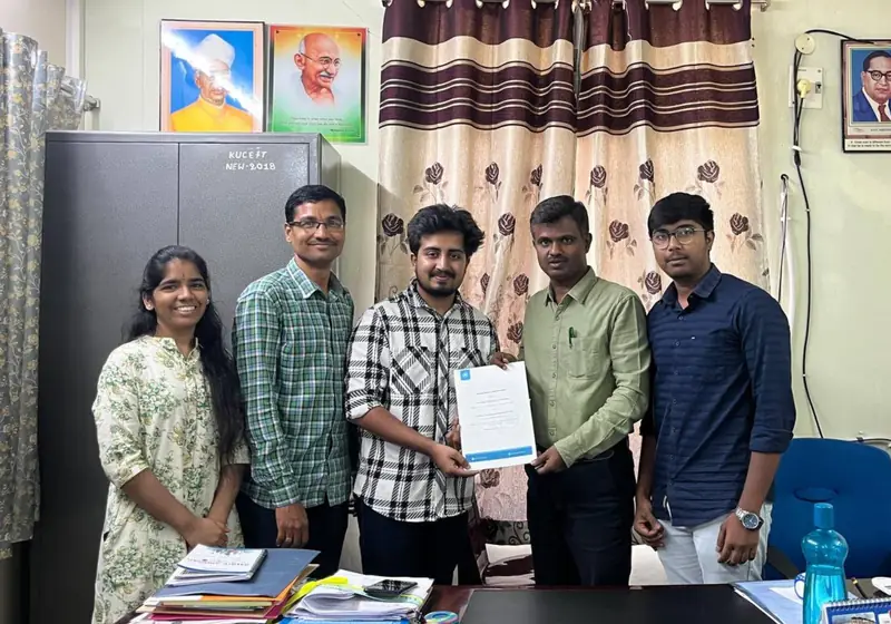 Poditivity team with faculty holding the signed MoU at Kakatiya University